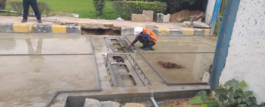 Weigh in motion plate pit being prepared in a toll lane during installation