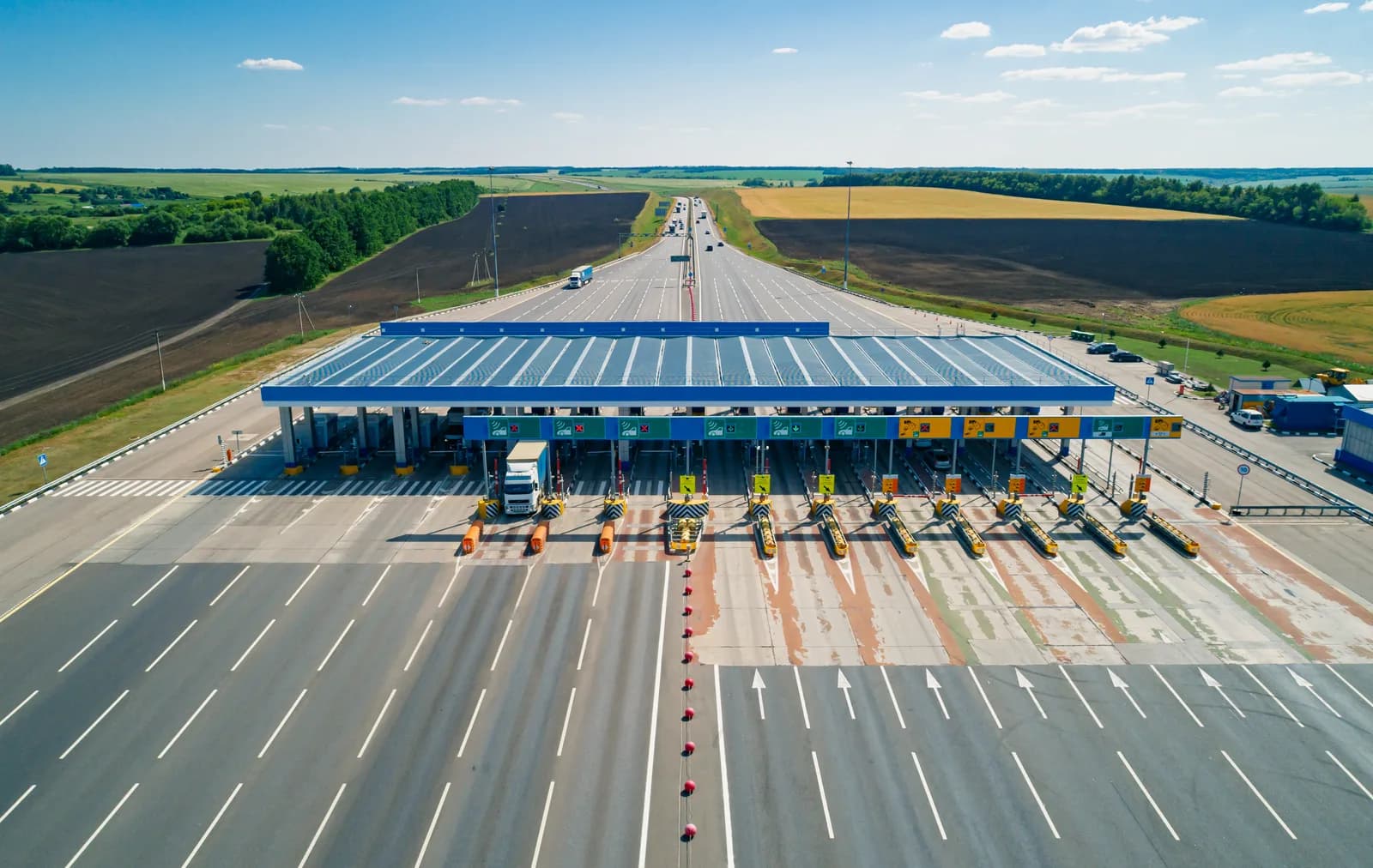 Toll management system at a highway plaza